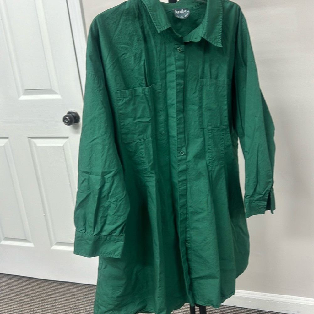 arula long half sleeve blouse with two pockets on the chest .